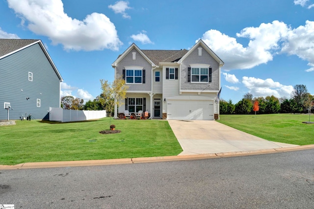 view of front of home with a front lawn and a garage