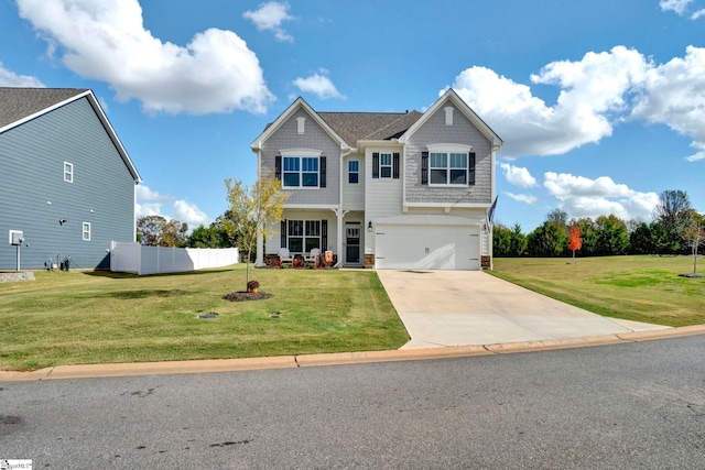 view of front of home featuring a front yard and a garage