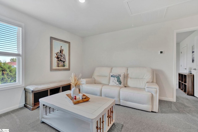 living room featuring light carpet