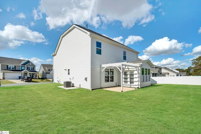 back of house with a yard, a pergola, a patio area, and central AC unit