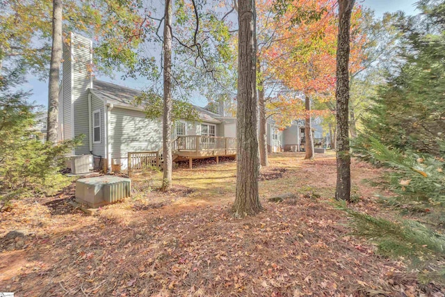 view of yard featuring a wooden deck