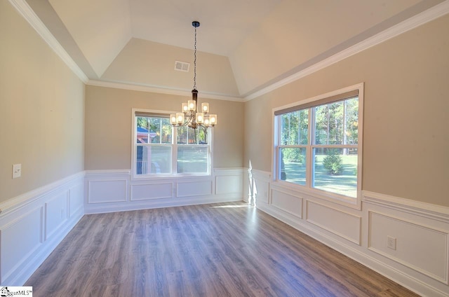 113 Bonaire Pointe Smithbrook Subdivision, Anderson, SC 29621 - unfurnished dining area with a chandelier, a decorative wall, wainscoting, lofted ceiling, and wood finished floors
