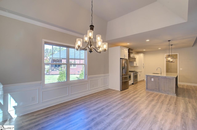 113 Bonaire Pointe Smithbrook Subdivision, Anderson, SC 29621 - kitchen with appliances with stainless steel finishes, a sink, a chandelier, white cabinets, and light wood finished floors
