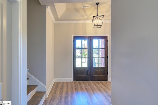 113 Bonaire Pointe Smithbrook Subdivision, Anderson, SC 29621 - foyer entrance with french doors, wood finished floors, ornamental molding, a chandelier, and baseboards