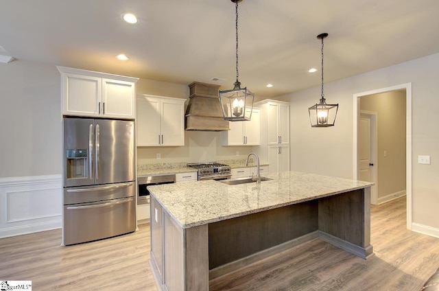 113 Bonaire Pointe Smithbrook Subdivision, Anderson, SC 29621 - kitchen with appliances with stainless steel finishes, a sink, white cabinetry, custom range hood, and a center island with sink