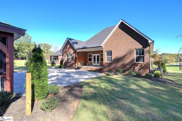 113 Bonaire Pointe Smithbrook Subdivision, Anderson, SC 29621 - view of front of property featuring french doors, brick siding, a front yard, and covered porch