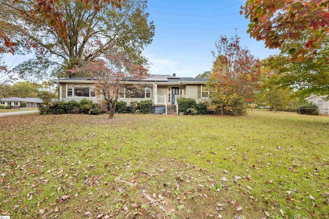 ranch-style home featuring a front yard