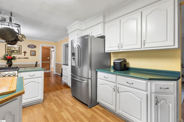 kitchen with light hardwood / wood-style flooring, crown molding, stainless steel fridge with ice dispenser, white cabinets, and a textured ceiling