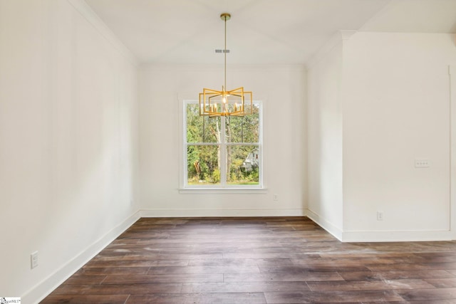 unfurnished room with a notable chandelier, ornamental molding, and dark hardwood / wood-style floors