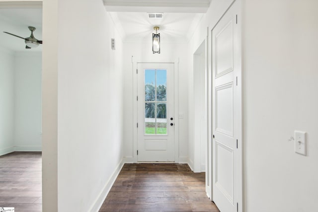 entryway with crown molding, ceiling fan, and dark hardwood / wood-style flooring