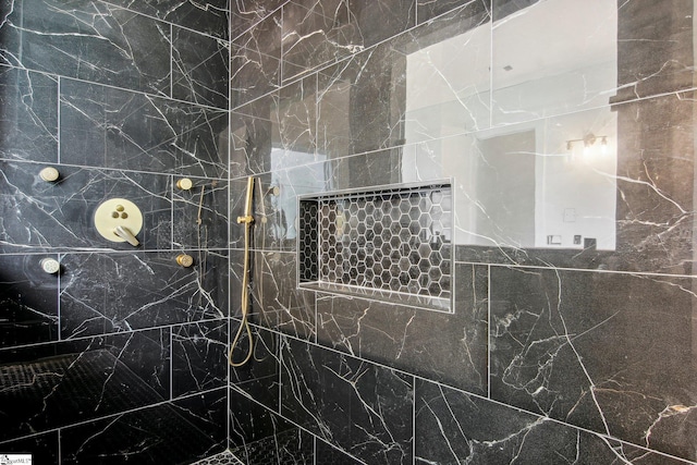 bathroom featuring tile walls and tiled shower