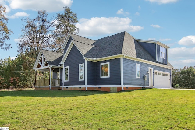 view of front of property with a front lawn and a garage