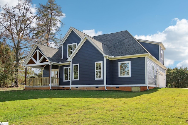 view of front facade with a front lawn, a deck, and a garage