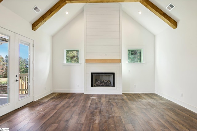 unfurnished living room featuring a large fireplace, high vaulted ceiling, and dark hardwood / wood-style flooring