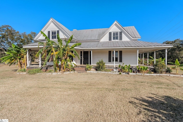 farmhouse-style home with a porch and a front yard