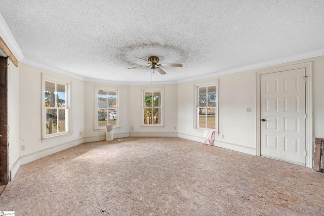 interior space featuring ceiling fan, a textured ceiling, and plenty of natural light