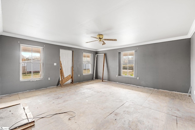 unfurnished room with crown molding and ceiling fan