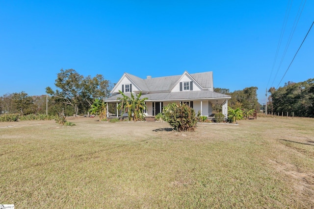 view of front of house featuring a front yard and covered porch