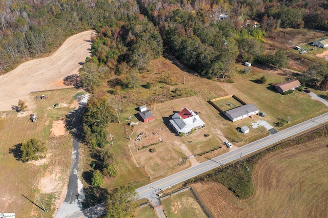 birds eye view of property featuring a rural view