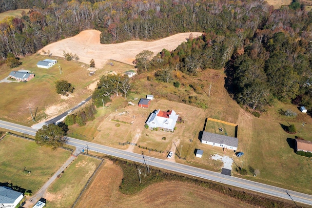 birds eye view of property with a rural view