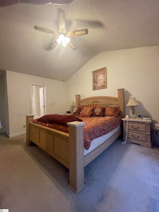 bedroom featuring ceiling fan, a textured ceiling, carpet, and lofted ceiling