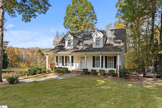 cape cod-style house with a front yard and a porch