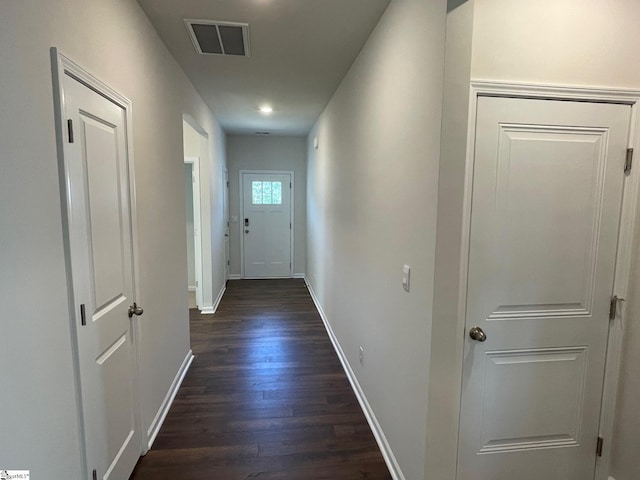 hall with dark wood-type flooring