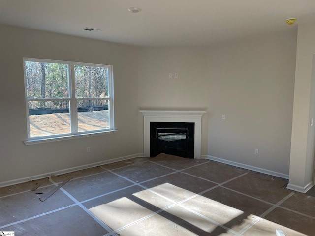 unfurnished living room featuring dark tile patterned flooring