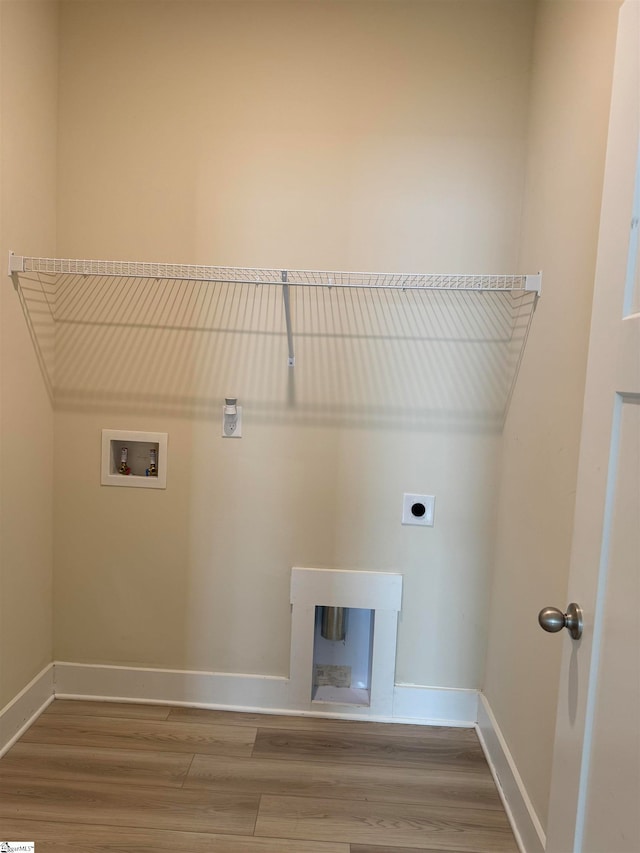 laundry area featuring hookup for an electric dryer, hardwood / wood-style floors, and hookup for a washing machine