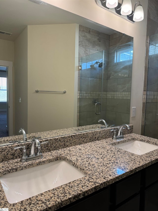 bathroom featuring vanity and walk in shower