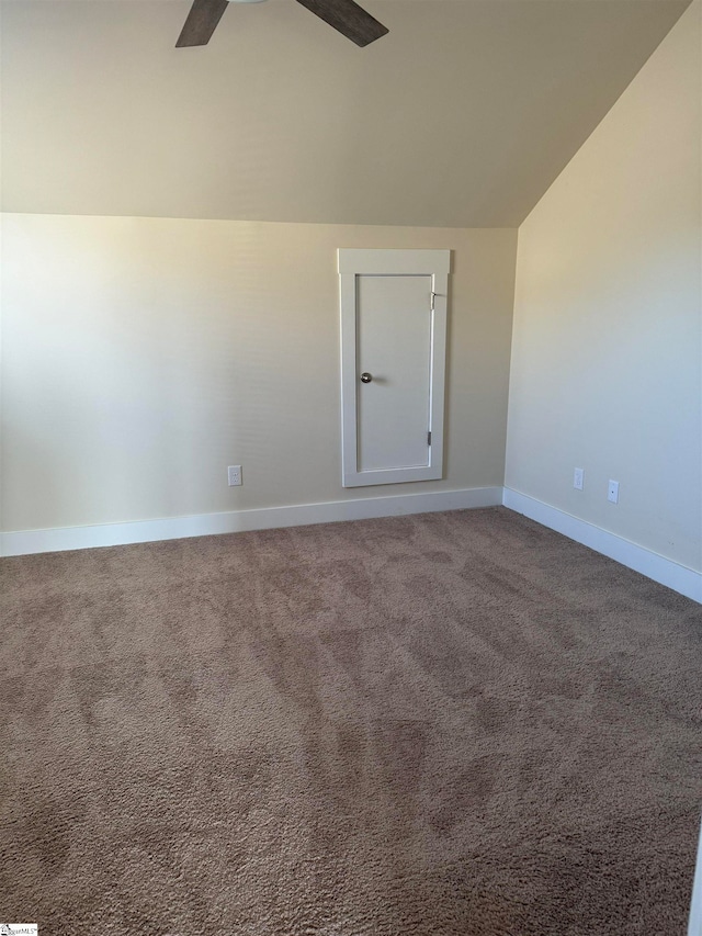 carpeted spare room with lofted ceiling and ceiling fan