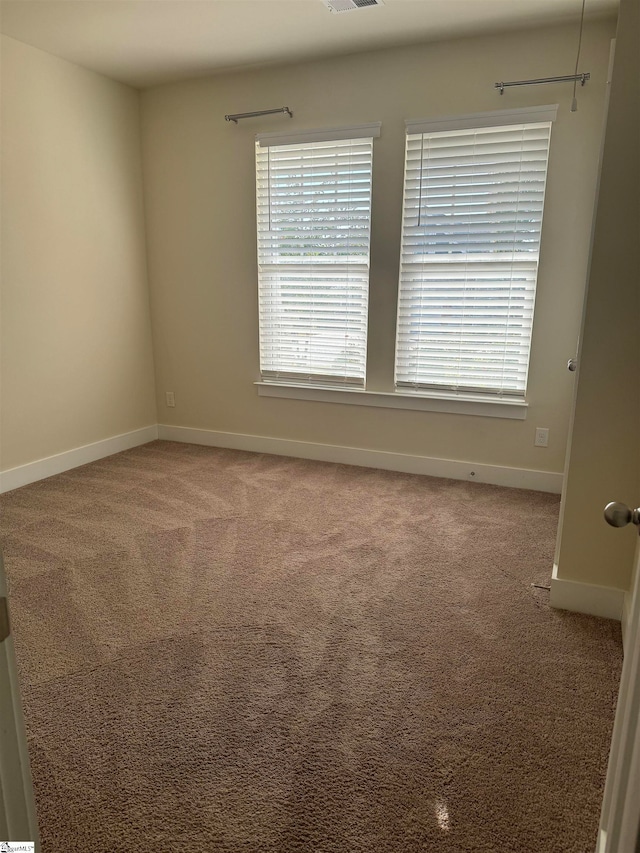 empty room featuring carpet floors