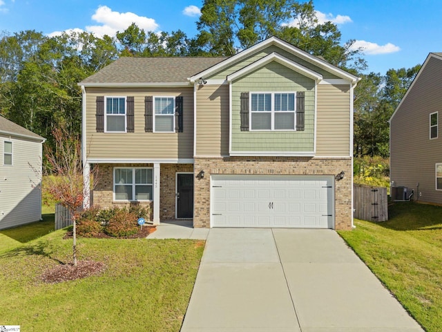 view of front of home with central AC, a front yard, and a garage