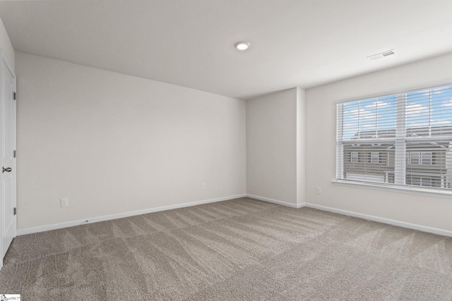 empty room featuring carpet floors