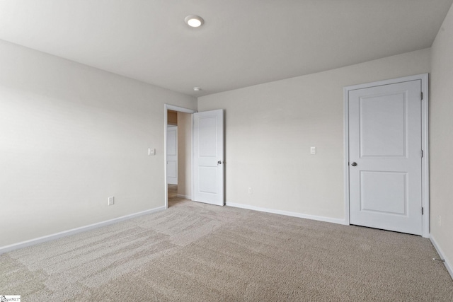 spare room with light colored carpet