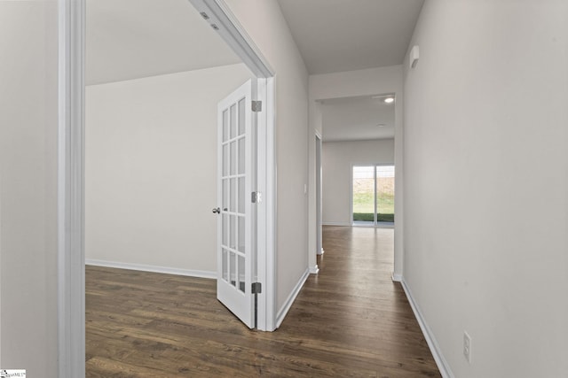 hallway featuring dark hardwood / wood-style flooring