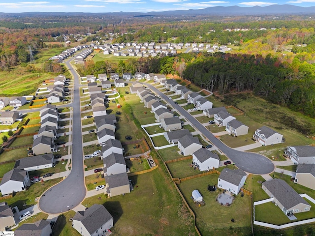 birds eye view of property with a mountain view