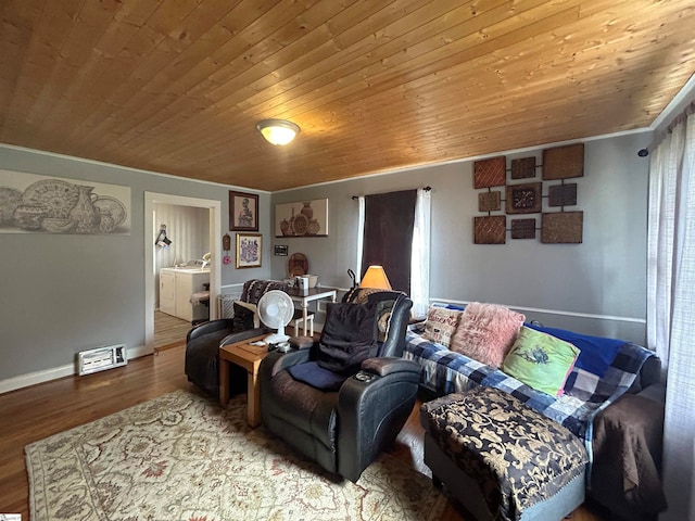 cinema with ornamental molding, hardwood / wood-style floors, washer and dryer, and wood ceiling