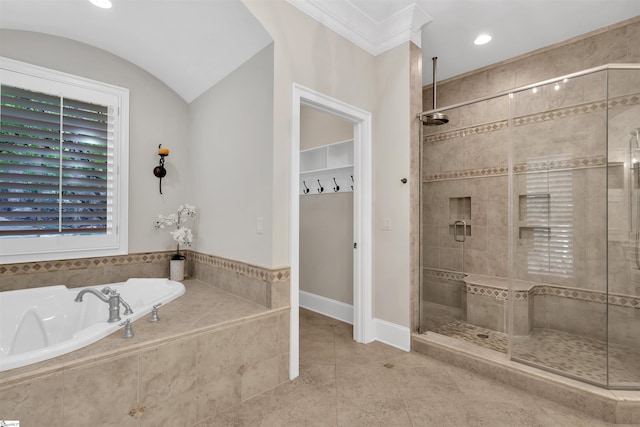 bathroom featuring tile patterned floors, vaulted ceiling, and shower with separate bathtub