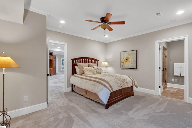 bedroom with connected bathroom, crown molding, light colored carpet, and ceiling fan