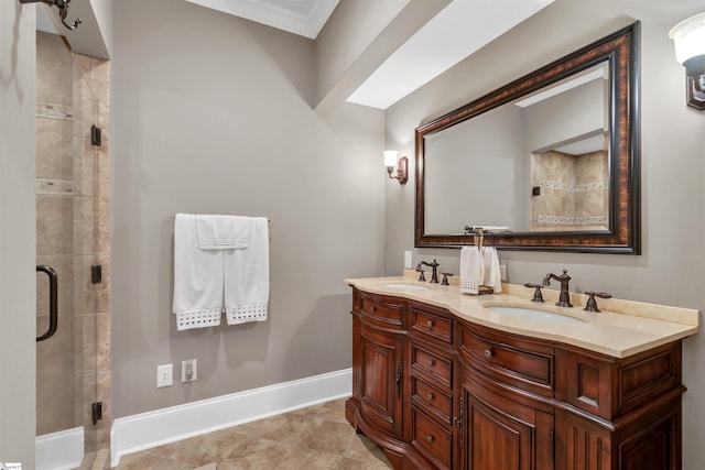 bathroom featuring vanity, a shower with shower door, ornamental molding, and tile patterned floors