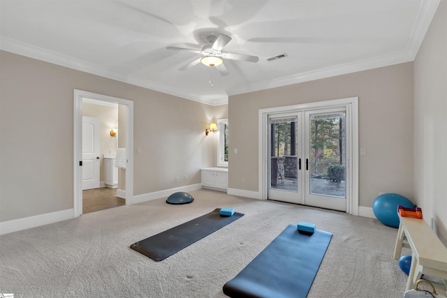 workout room with ornamental molding, french doors, light carpet, and ceiling fan