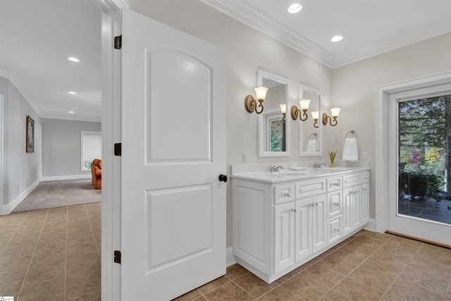 bathroom with vanity, ornamental molding, and tile patterned floors