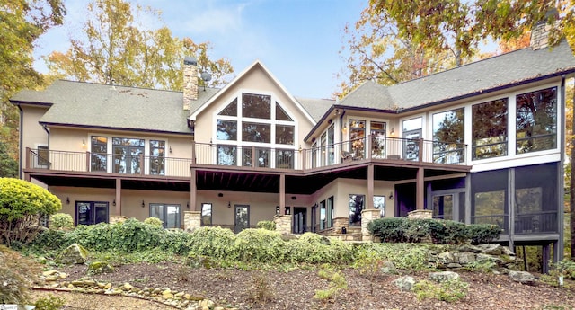 rear view of house featuring a balcony