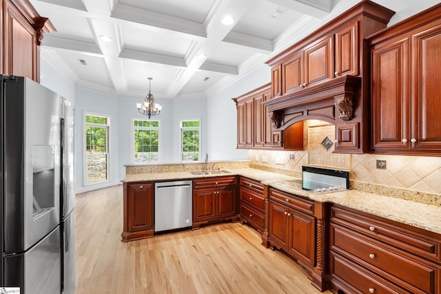 kitchen featuring hanging light fixtures, light hardwood / wood-style floors, stainless steel appliances, crown molding, and decorative backsplash