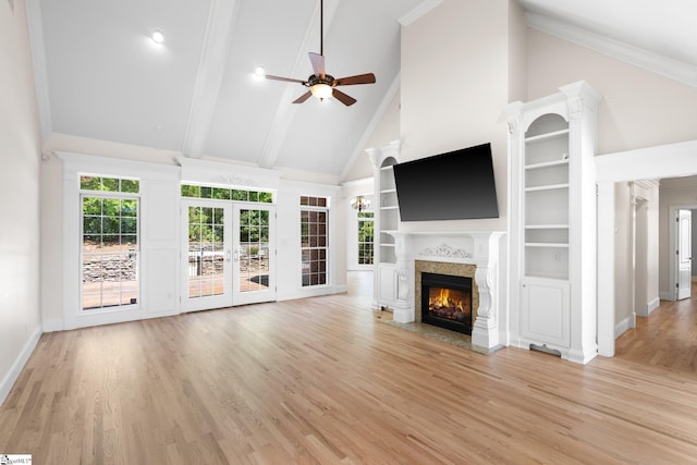 unfurnished living room with a fireplace, high vaulted ceiling, light wood-type flooring, and ceiling fan