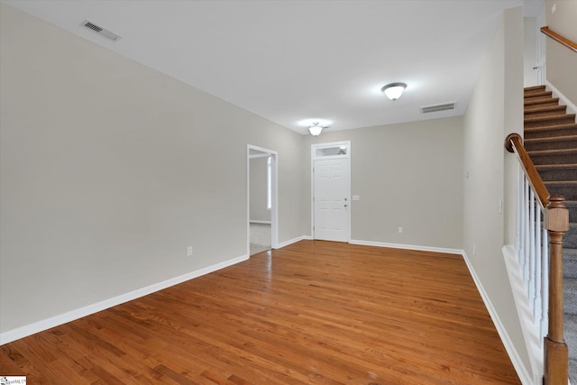 empty room with wood-type flooring