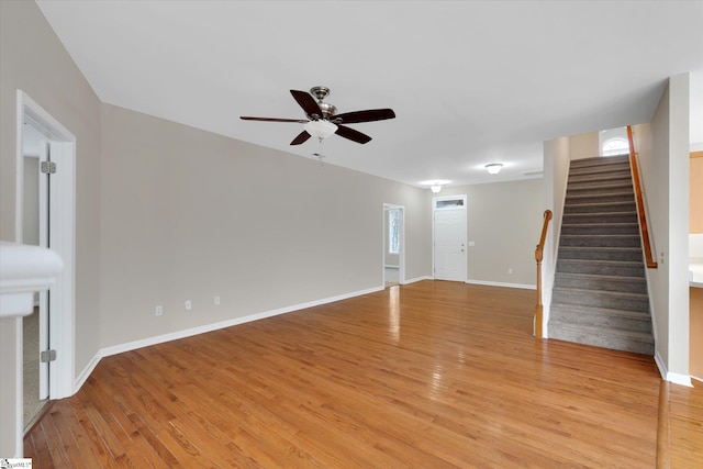 unfurnished living room featuring ceiling fan and light hardwood / wood-style flooring