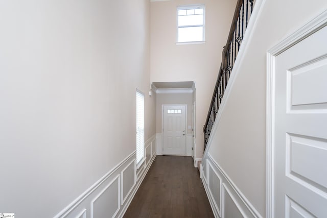 doorway with dark hardwood / wood-style floors