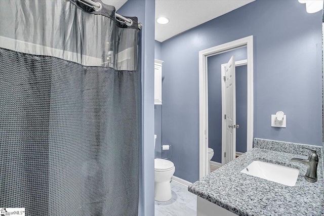 bathroom featuring vanity, a shower with curtain, and toilet